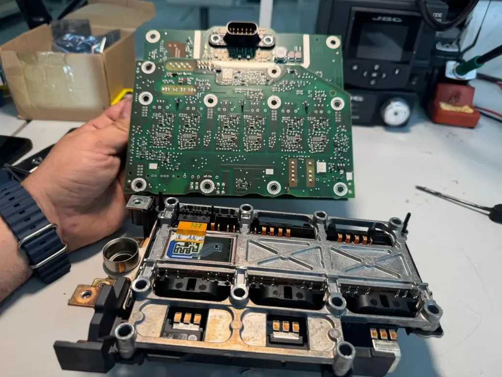 Inverter power stage with its driver board lifted off.